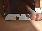 a piece of luggage sitting on top of a wooden table