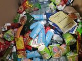 a cardboard box filled with various types of food and drinks