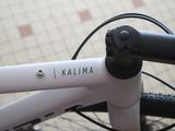 a close up view of a bicycle handlebar with the word kalama written on it