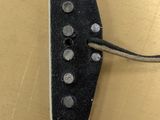 a close up of an electric guitar with a black pickup