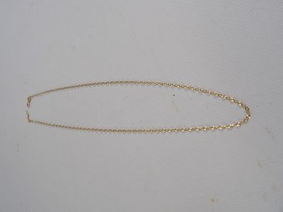 the gold chain is attached to the back of the necklace