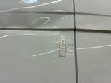 a close up of a car door with a sticker on it