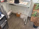 a picture of a desk with a lot of papers on it
