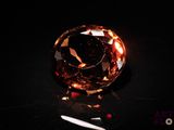 a close up of a diamond on a black surface