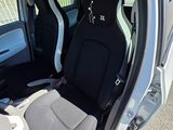 two seats in the back of a car with the door open