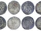 six different types of silver coins with a cross on them
