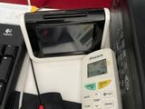a picture of a desk with a telephone, a keyboard, a mouse and a printer