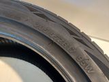 the tire of a car is shown on the side of the road
