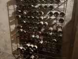 many bottles of wine on the rack in the room