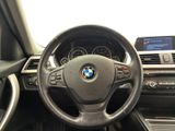 the interior of a car with a steering wheel and dashboard controls