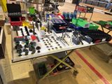 a table with many different tools on it in a warehouse