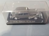 a box with a toy car inside of it on a table