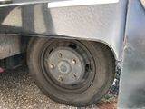 a close up of a flat tire on a truck