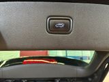 a close up of a car ' s dashboard with a remote control