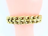 an image of a gold chain bracelet on a mannequin hand