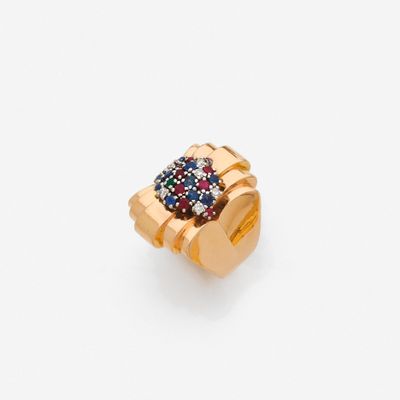 an image of a gold ring with blue, red and white stones