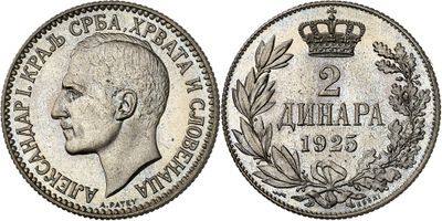 a silver coin with a crown on top of it