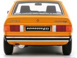an orange car with a license plate on the back of it