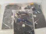 a white box with a black shirt and a pair of scissors in it