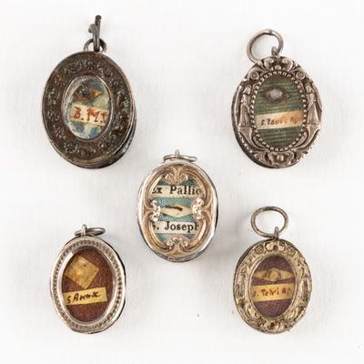 four silver and enamel lockes with different designs on them