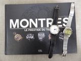 a book with a watch and a book with a picture on it