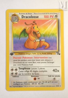 pokemon card with a picture of a dragon sitting on top of it
