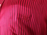 striped red shirt with a butterfly embroidered on the chest