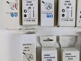 several boxes of different type of electrical devices on a white surface