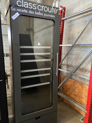 an image of a glass door refrigerator in a warehouse