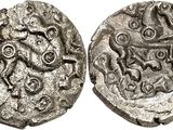 a silver coin with an image of a man on it