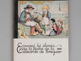 un livre sur lequel figure la photo d'une famille assise dans l'herbe