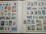 a book with stamps on it sitting on a table