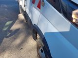 a white truck that is parked on the side of the road
