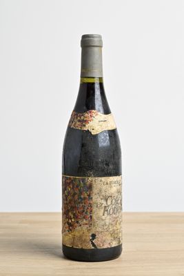 a bottle of wine that is sitting on a table