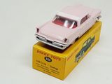 a pink toy car sitting on top of a yellow box
