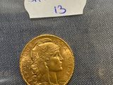 a close up of a gold coin with a label on it
