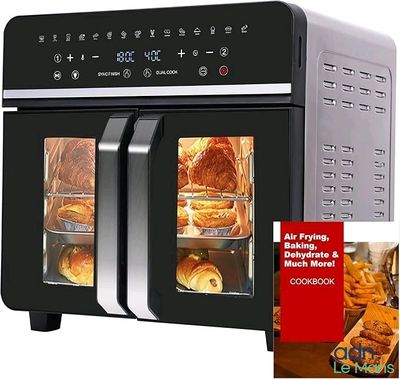 a black and silver air fryer oven with baked goods in it