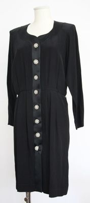 an image of a black dress on a mannequin stand