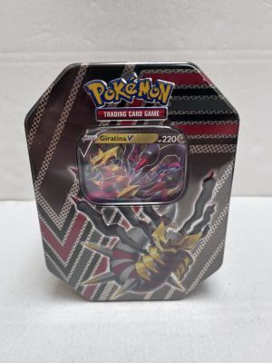 a close up of a box of pokemon trading cards on a table