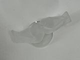 a plastic bird that is sitting on a white surface