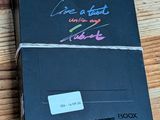 a black box with writing on it sitting on a wooden table