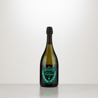 the bottle of champagne is sitting on a table with a white background