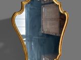 a mirror that is sitting on the wall in the room