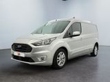 une fourgonnette Ford Transit garée dans une pièce blanche au sol noir