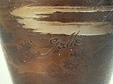 a brown vase that is sitting on a table