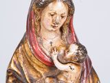 an image of a statue of a woman holding a baby