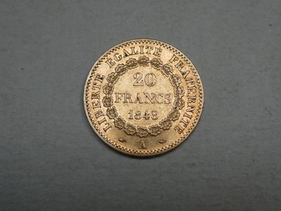 a gold coin with the inscription 20 frans on it