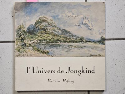 a book with a picture of a mountain in the background