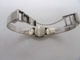 an image of a close up of a bracelet on a white surface