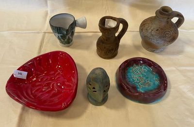 many different types of pottery on the table